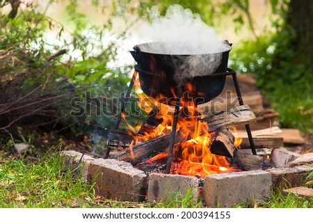 Preparing food on campfire