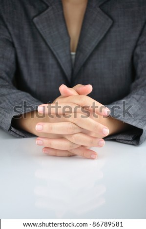 A business man with an clasp hand to contemplate