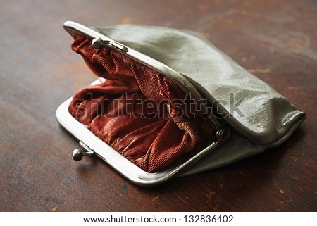 Empty pocket on the wooden table
