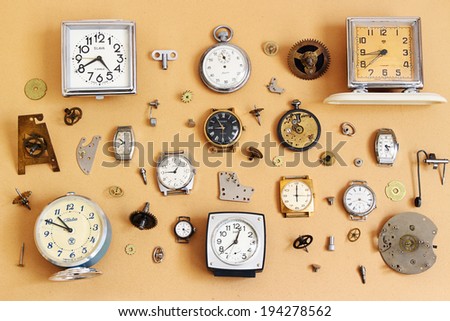ST.PETERSBURG, RUSSIA -  17 May 2014: Retro alarm clocks, watches and parts for mechanical watches (Soviet alarm clocks and watches brands Zaria, Slava, ZIM, Zvezda and  Swiss watch HY MOSER)