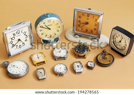 SAINT-PETERSBURG, RUSSIA -   May 17, 2014: Retro alarm clocks and watches (Soviet alarm clocks and watches brands Zaria, Slava, ZIM, Zvezda and  Swiss watch HY MOSER)