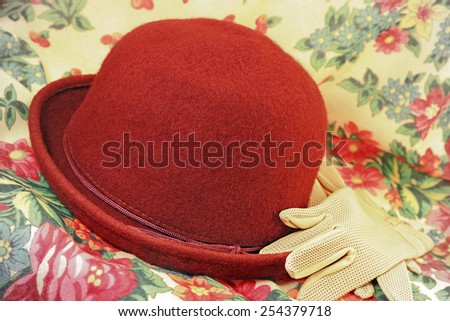 Brick red hat and gloves on headscarf, 1990s