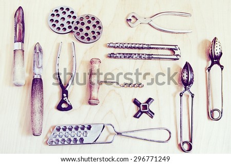 Old kitchen goods and instruments on wood background. Retro effect