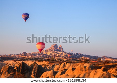 Hot air balloons rising at cappadocia in the morning sun