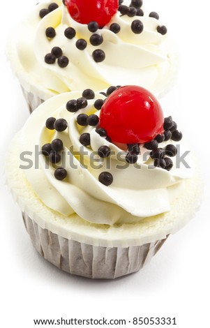 black forest cup cake with cherry and white cream