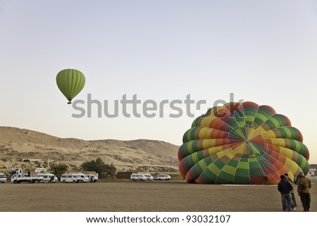 hot air balloon in front of valley of the king, luxor, egypt