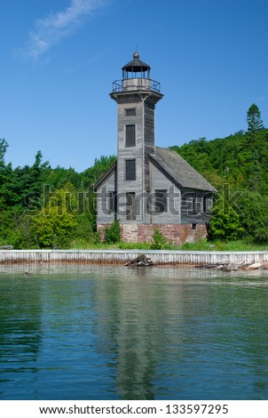 Old lighthouse on the Grand Island from the Superior Lake, Michigan, USA