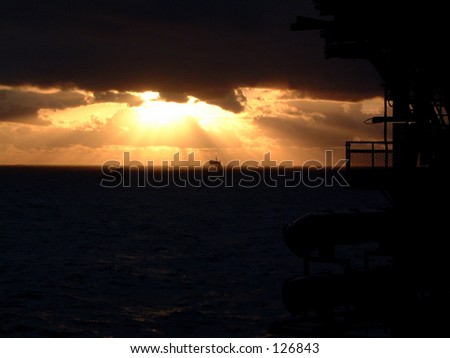 Sunset sea ocean cloud color offshore oil gas platform north sea water sky sunbeams