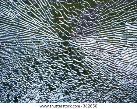 smashed shattered glass window pane gunshot cracks shards splinters pattern