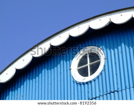 Blue House Lifeboat house blue walls white windows blue sky square window round window windows corrugated iron metal sheet paint bright colour sun light