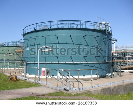 Industrial tanks with water spray fire extinguisher and cooling system.