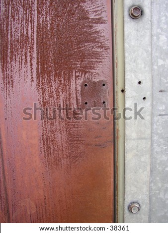 door frame from a rusted iron door on a metal shed