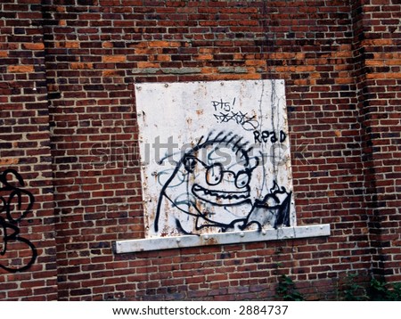 Reading Monster in Graffiti on Brick Wall