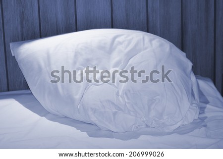 single pillow on a bed
