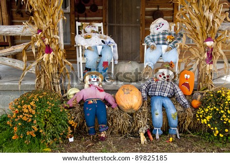 Scarecrows, corn stalks, and pumpkins for fall decorations