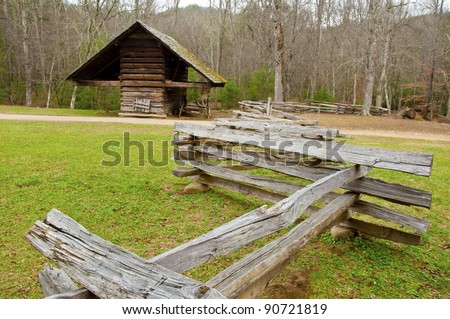 Wooden corn crib and split rail fence