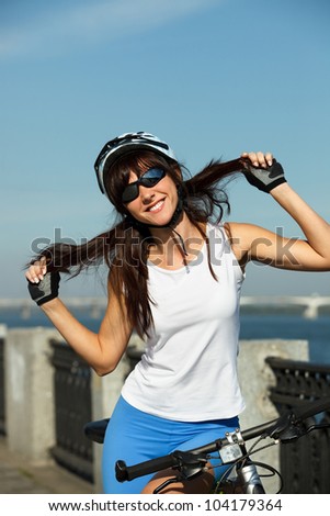 Portrait of young happy cyclist outdoor