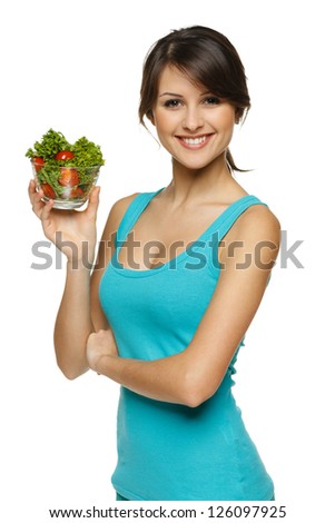 Smiling woman holding healthy salad meal over white Smiling woman holding healthy salad meal over white