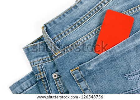 Cropped picture of blue jeans with blank red credit card in the pocket, over white with copy space