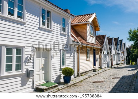 STAVANGER, NORWAY - AUGUST 10:  Street with white wooden houses in old centre of Stavanger, Norway. Tourist attraction on August 10, 2013 in Stavanger, Norway