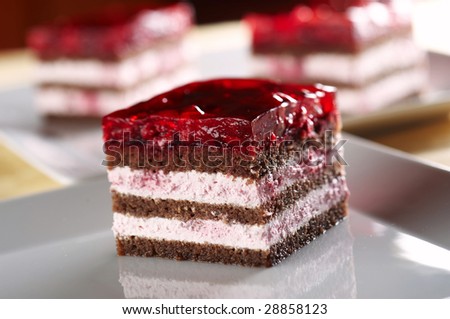 Biscuit cake with raspberry cream and jelly