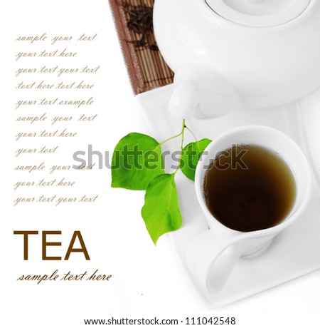 Tea breakfast (cup of tea, fresh green leaves, tea pot and bamboo mat isolated on white background with sample text)