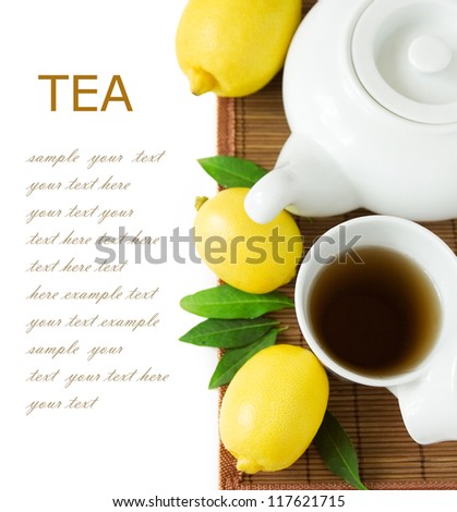 Tea breakfast with lemons (still life with tea cup.lemons and fresh green leaves isolated on white background with sample text)