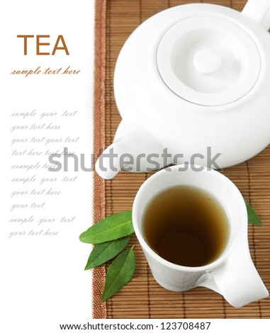 Tea breakfast (still life with tea cup and fresh green leaves isolated on white background with sample text)