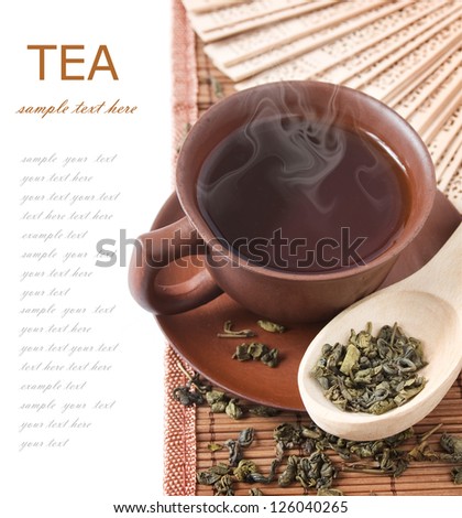 Tea breakfast (still life with tea cup and tea leaves isolated on white background with sample text)