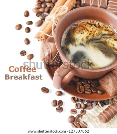Coffee breakfast (cup of coffee, cinnamon, chocolate candy and coffee beans isolated on white background with sample text)