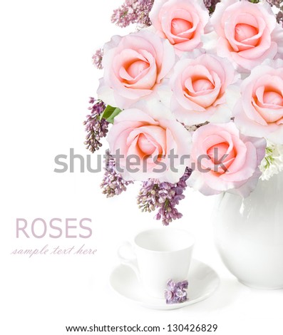 Still life with lilac flowers and roses bunch in vase and cup isolated on white background