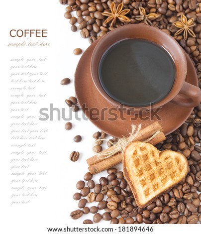 Cup of coffee with heart cake, spice and coffee beans isolated on white background