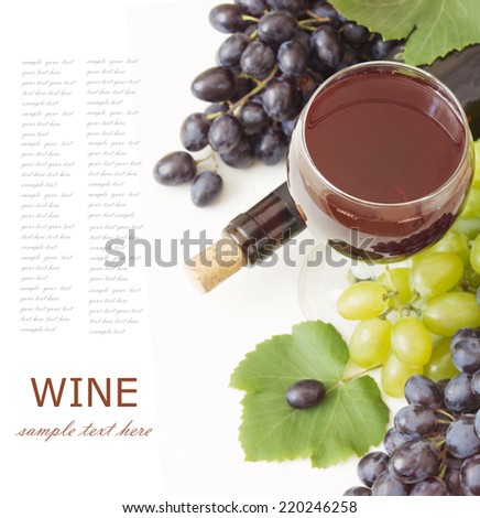 Red wine and grapes with fresh leaves isolated on white background with sample text