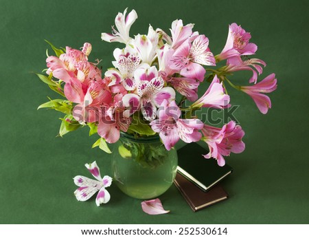 World Teacher\'s Day (still life with flowers bunch and books on artistic background)