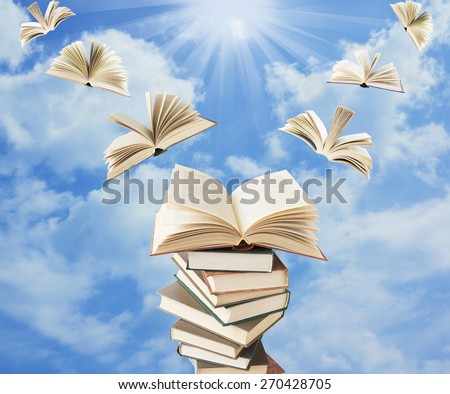 Book pile with open books flying away. Education concept