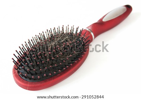 Hair  comb with hair isolated on white background. Falling out hair concept