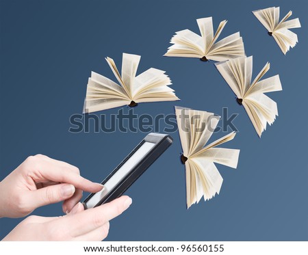 Hand holding electronic book and opened books flying away (education concept)