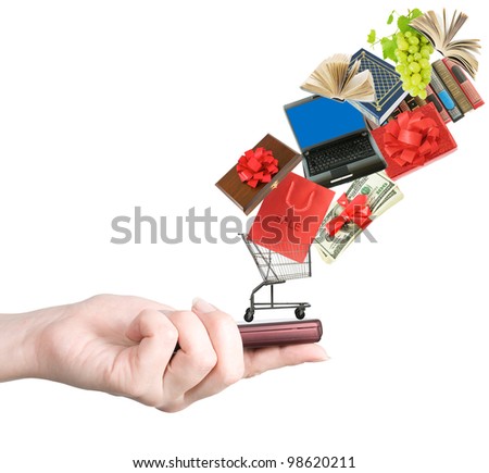 Modern mobile phone in the hand with lots of goods isolated on white (e-shopping and sale concept)