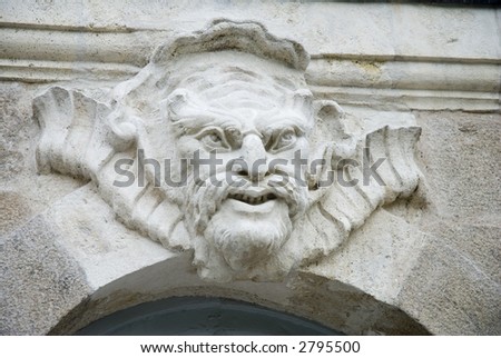 Architectural sculpture - mascaron - on the facade of a 18th century building in Nantes, France.