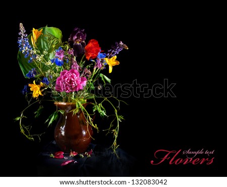 Vintage bunch of garden flowers isolated on black background.