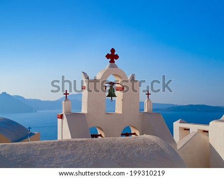 Bells on white little church on greek island, Santorini, Greece.