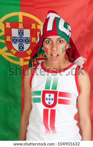 Soccer fan with a portuguese scarf and a surprise face