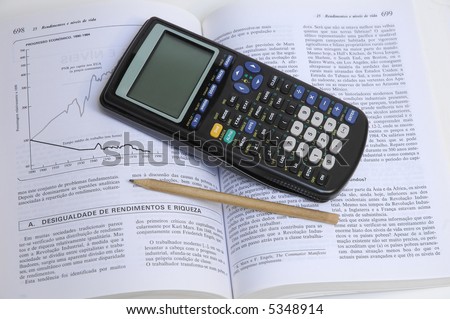 pencil and scientific calculator on a open book