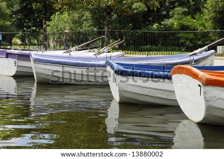 Colorful boats on boating lake, rowing for rent