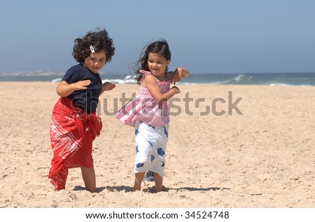 stock photo cute little girls dancing on the beach