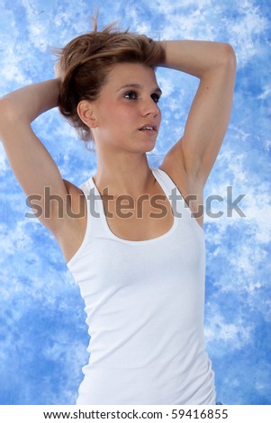 female model posing pushing hair with both hands