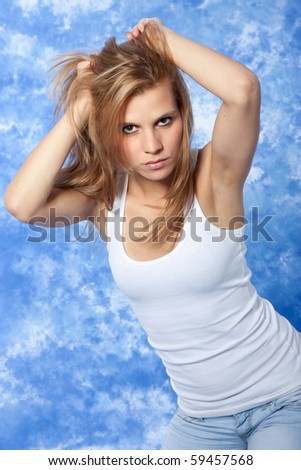 female model posing pushing hair with hands