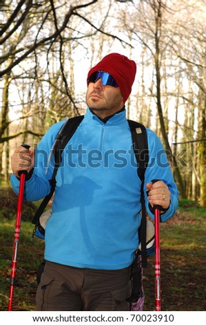 A handsome middle age hispanic latin man hiking