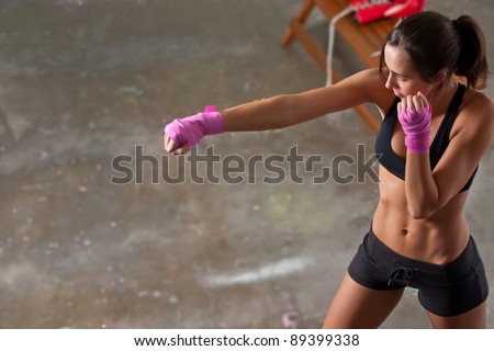 Girl training body combat