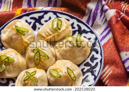 Uzbek national food manti on national fabric